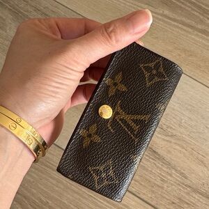 Authentic Louis Vuitton Black and Gold Monogram Key Holder